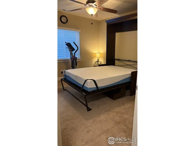 a room with a bed and a chandelier