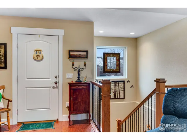 a view of a hallway and a livingroom with furniture