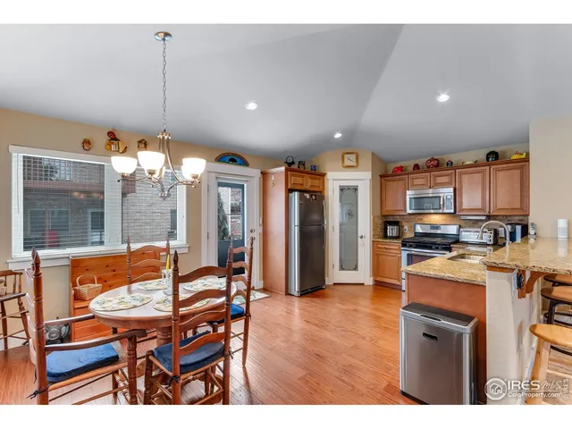 a living room with stainless steel appliances kitchen island granite countertop furniture and a kitchen view