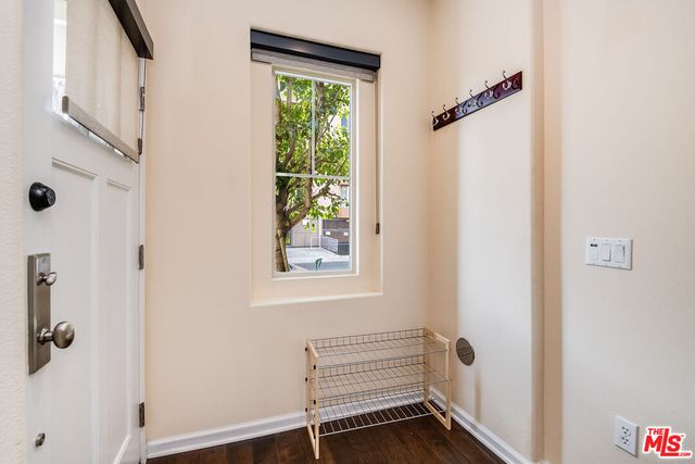 a view of room with window and hardwood floor