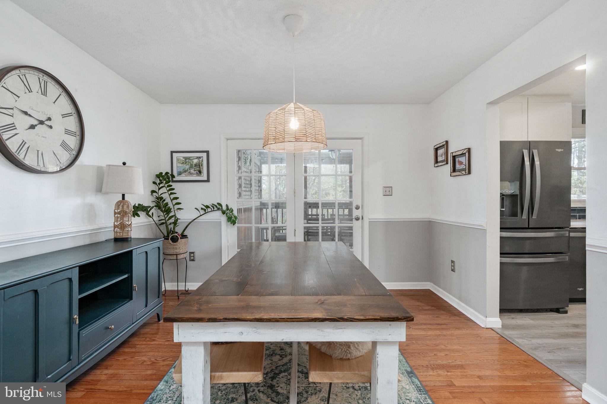 15195 Dyers Road Woodbridge, VA 22193 - Photo 12 of 53 a kitchen with kitchen island granite countertop a stove a refrigerator and a sink