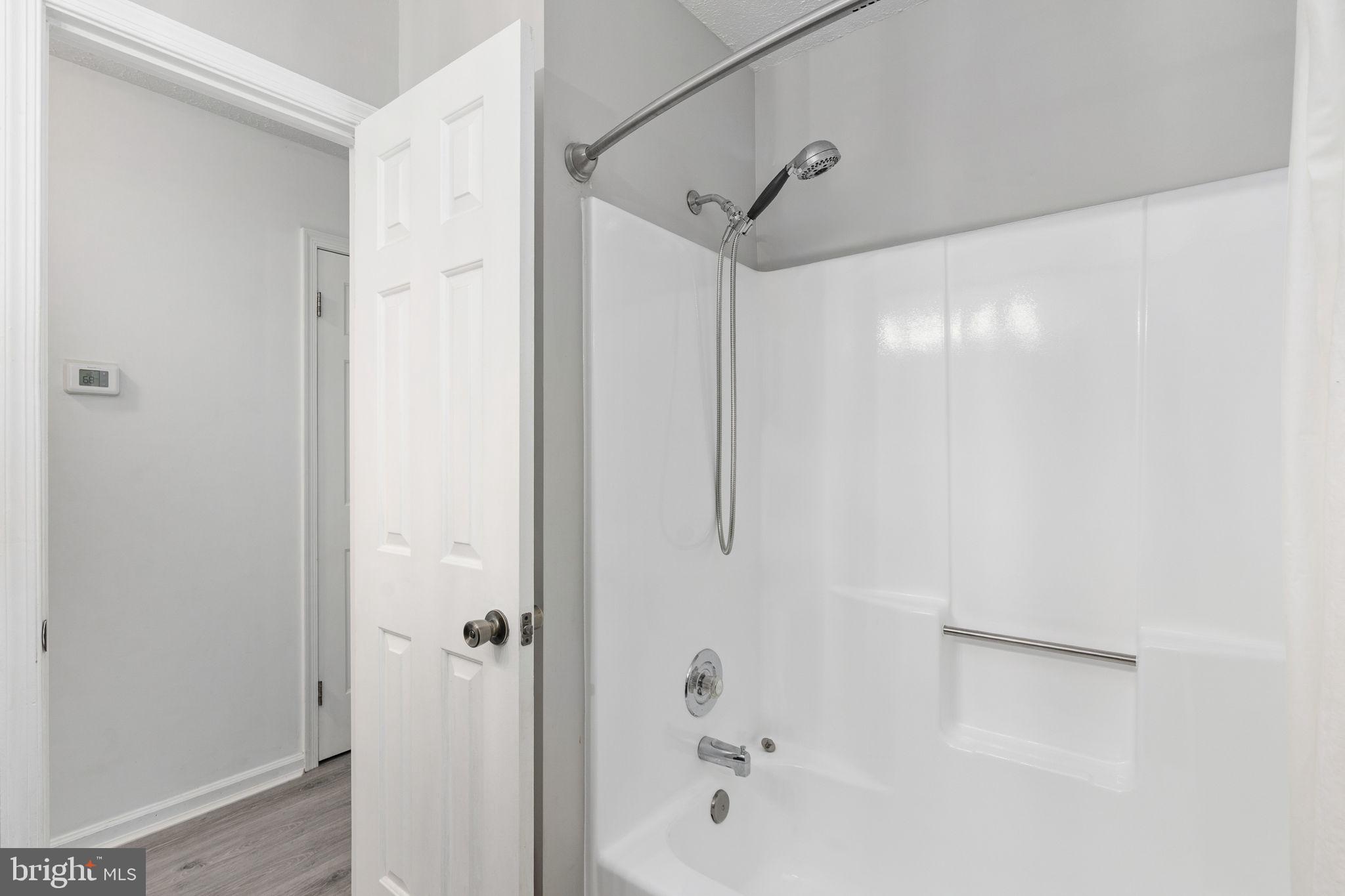 15195 Dyers Road Woodbridge, VA 22193 - Photo 23 of 53 a bathroom with a bathtub and a shower