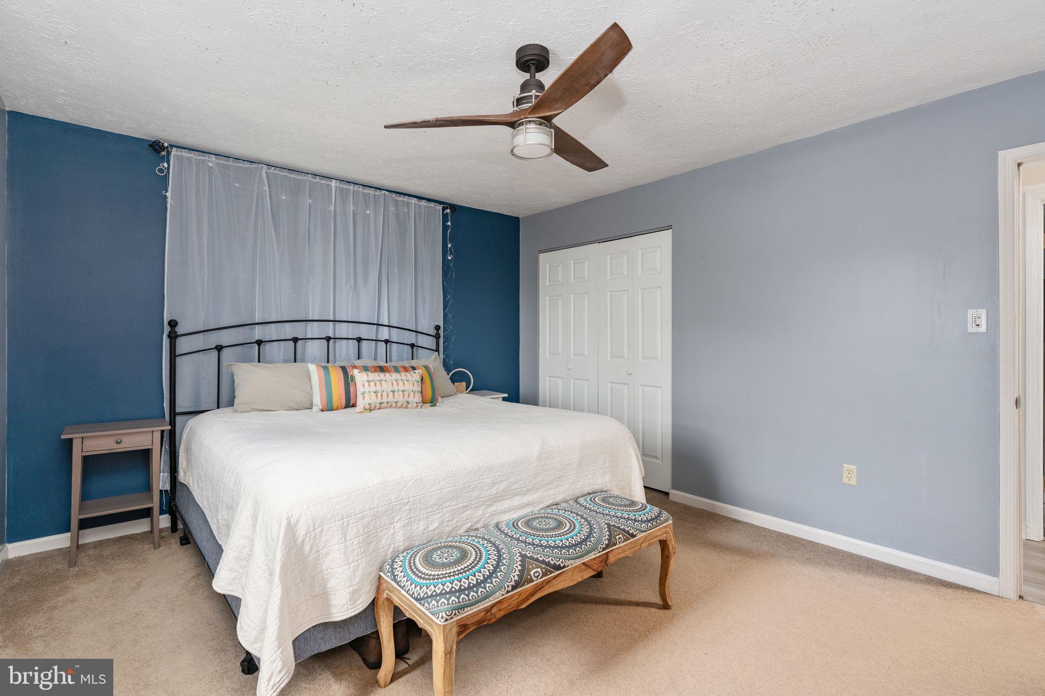 15195 Dyers Road Woodbridge, VA 22193 - Photo 27 of 53 a bedroom with a bed and a ceiling fan