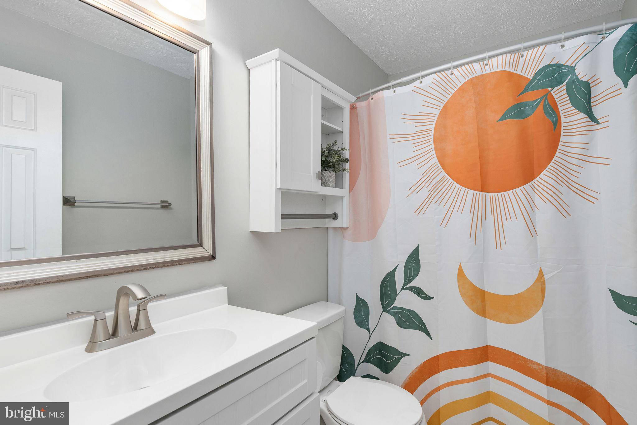 15195 Dyers Road Woodbridge, VA 22193 - Photo 30 of 53 a bathroom with a sink mirror and toilet