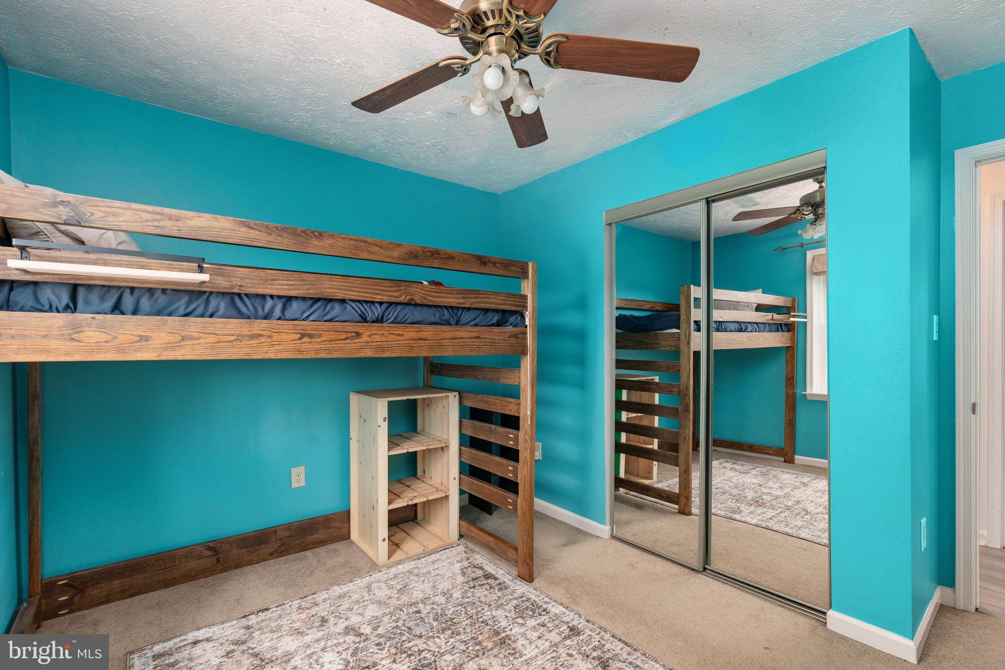 15195 Dyers Road Woodbridge, VA 22193 - Photo 32 of 53 a room with a bed and a bookshelf