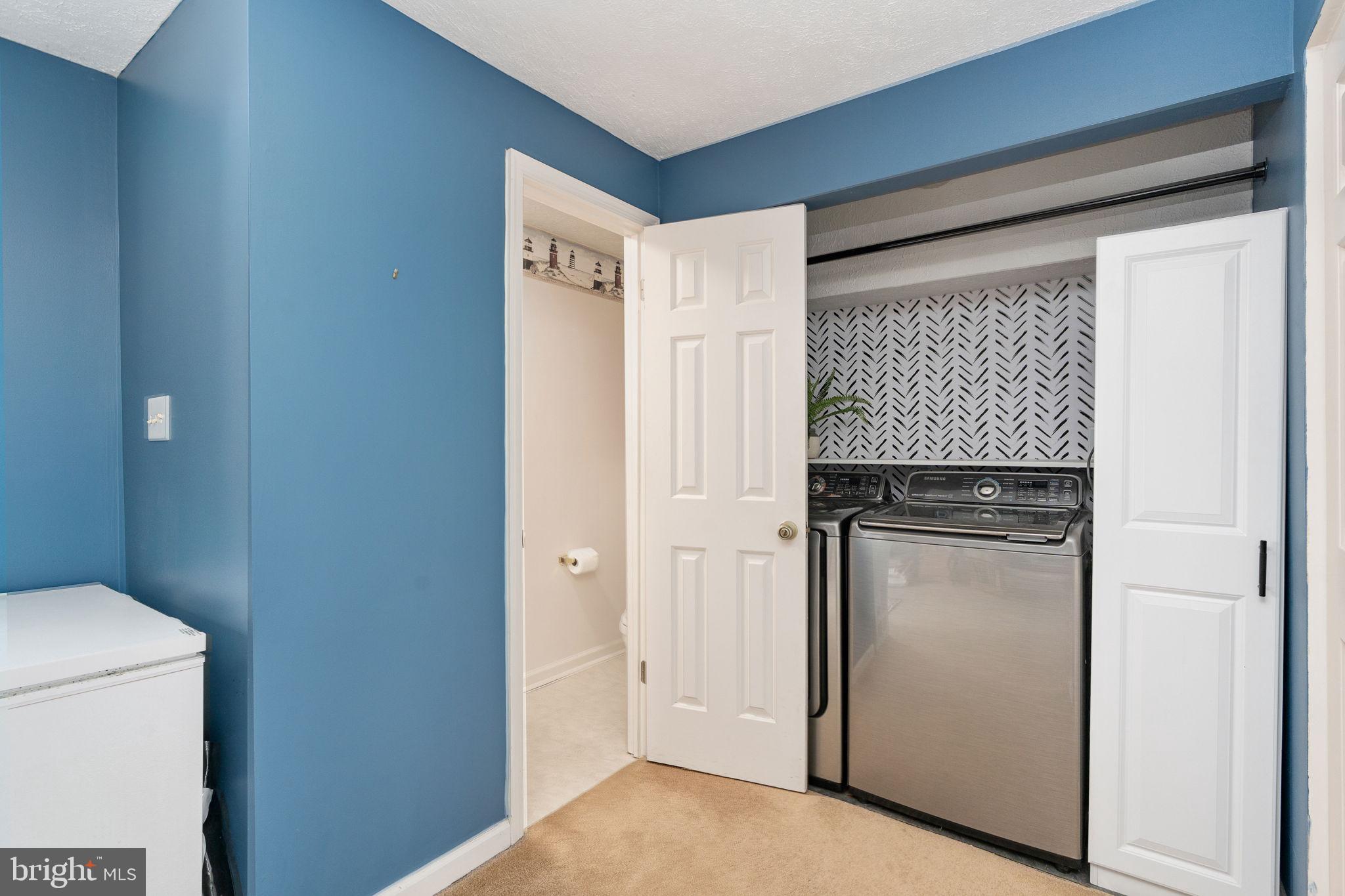 15195 Dyers Road Woodbridge, VA 22193 - Photo 40 of 53 a kitchen with a refrigerator cabinet and a sink