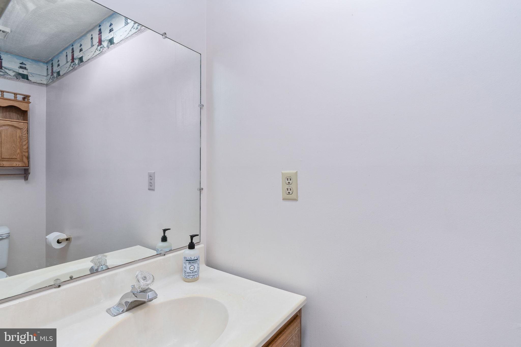 15195 Dyers Road Woodbridge, VA 22193 - Photo 41 of 53 a bathroom with a sink and a mirror