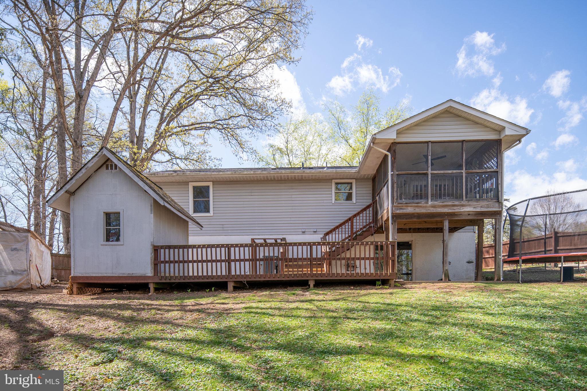15195 Dyers Road Woodbridge, VA 22193 - Photo 45 of 53 a house with trees in the background