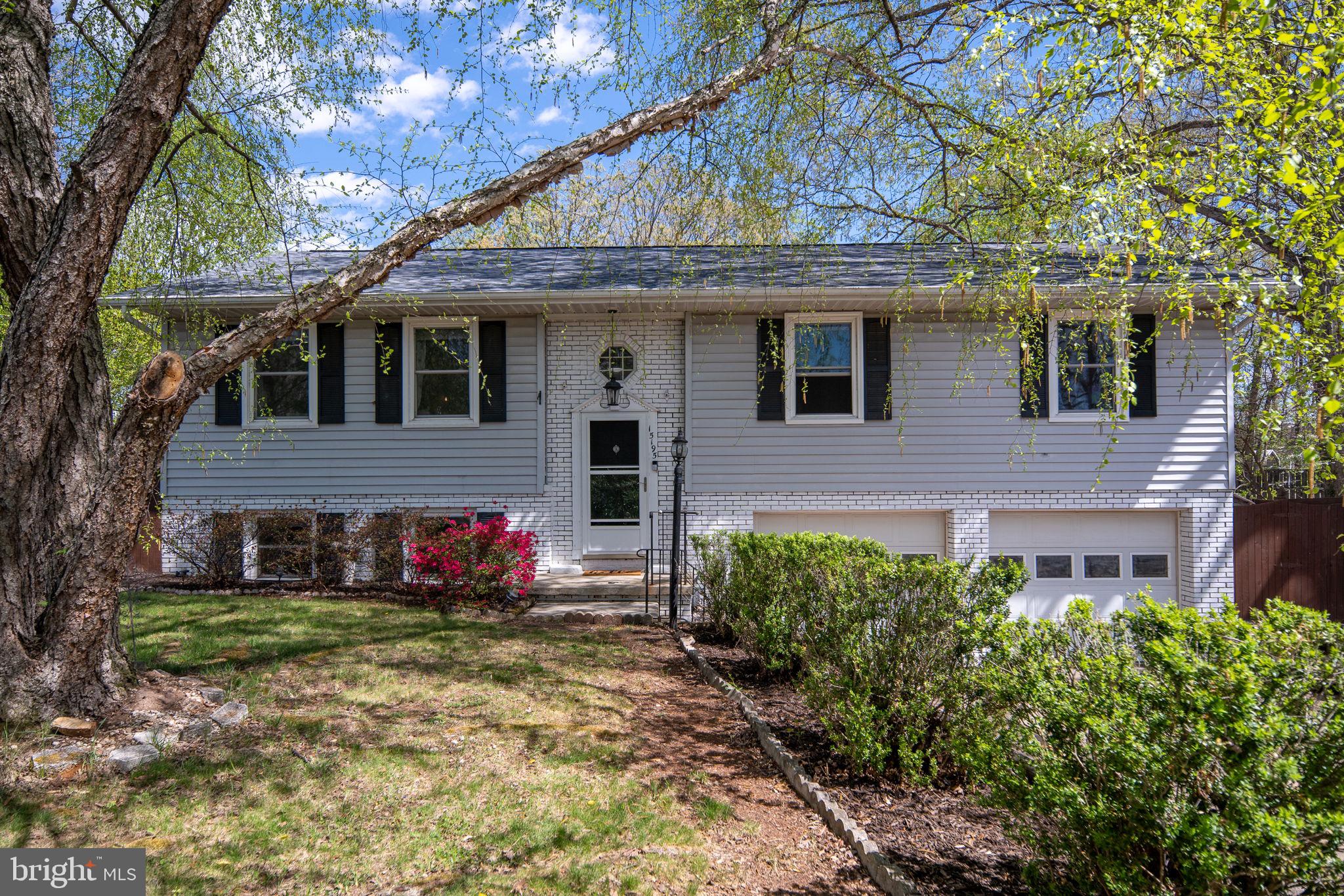 15195 Dyers Road Woodbridge, VA 22193 - Photo 8 of 53 a front view of a house with an outdoor space