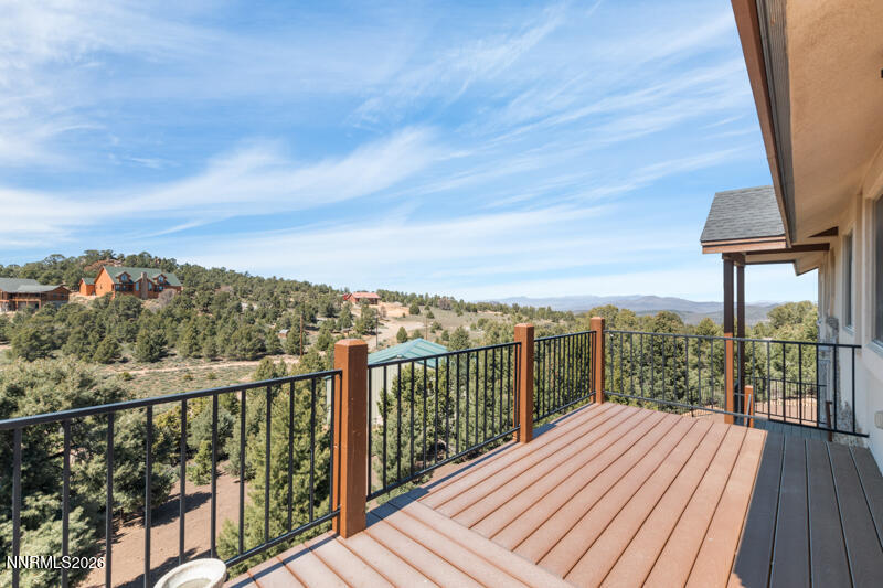 1367 Calavaras Road Reno, NV 89521 - Photo 20 of 26 a view of a balcony with wooden floor next to a yard