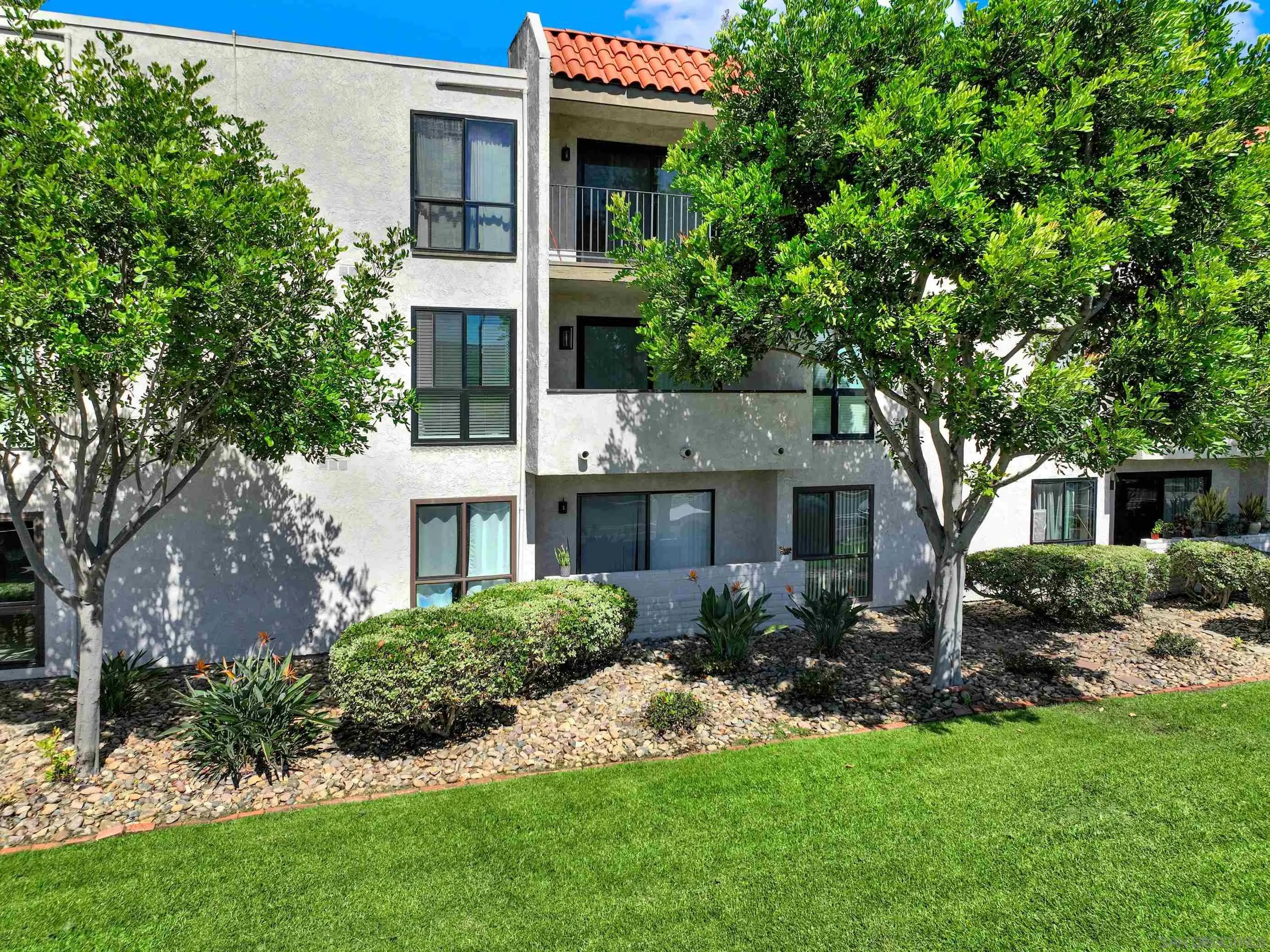 6780 Friars Road, Unit 153 San Diego, CA 92108 - Photo 13 of 21 a front view of a house with a garden
