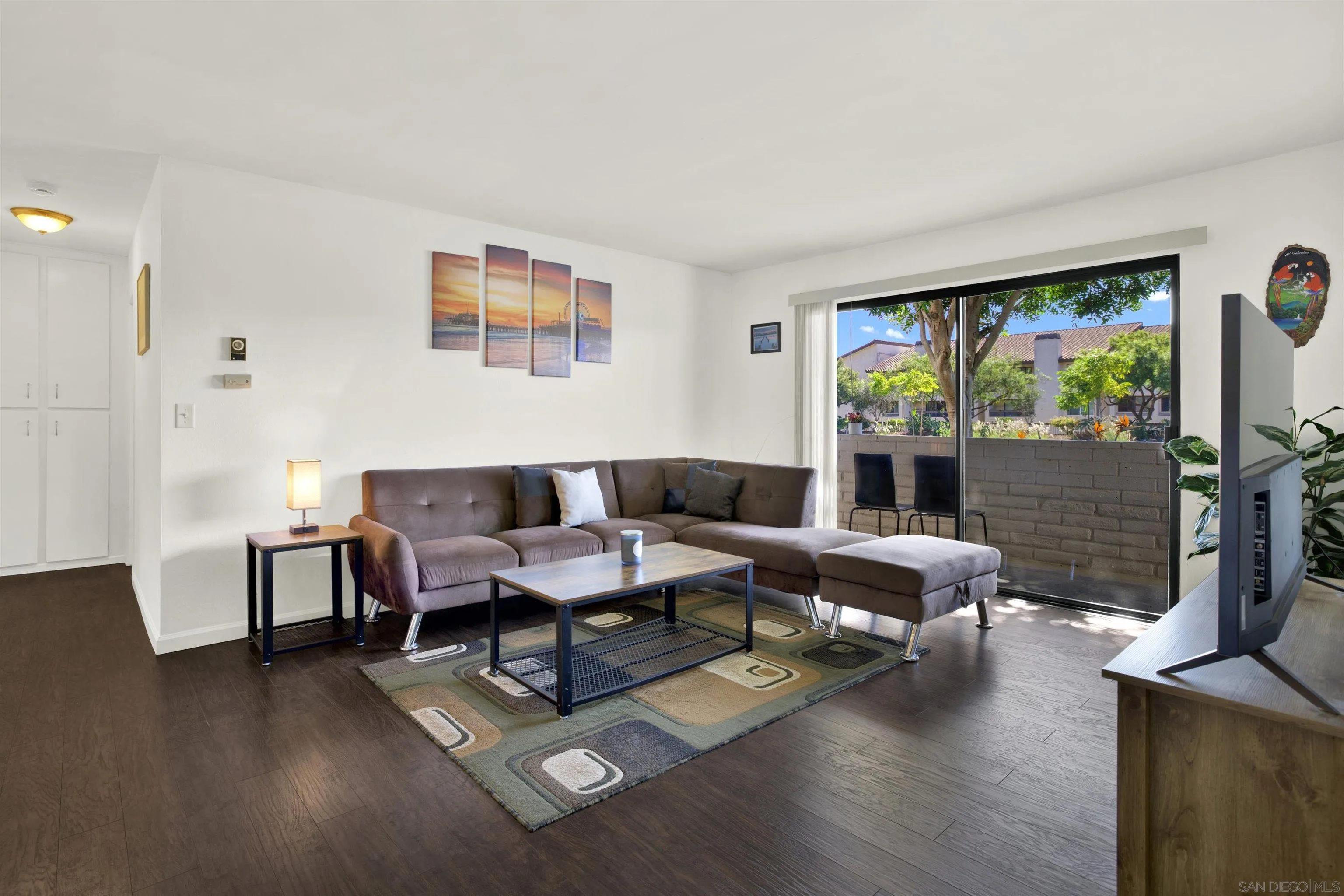 6780 Friars Road, Unit 153 San Diego, CA 92108 - Photo 3 of 21 a living room with furniture and a flat screen tv