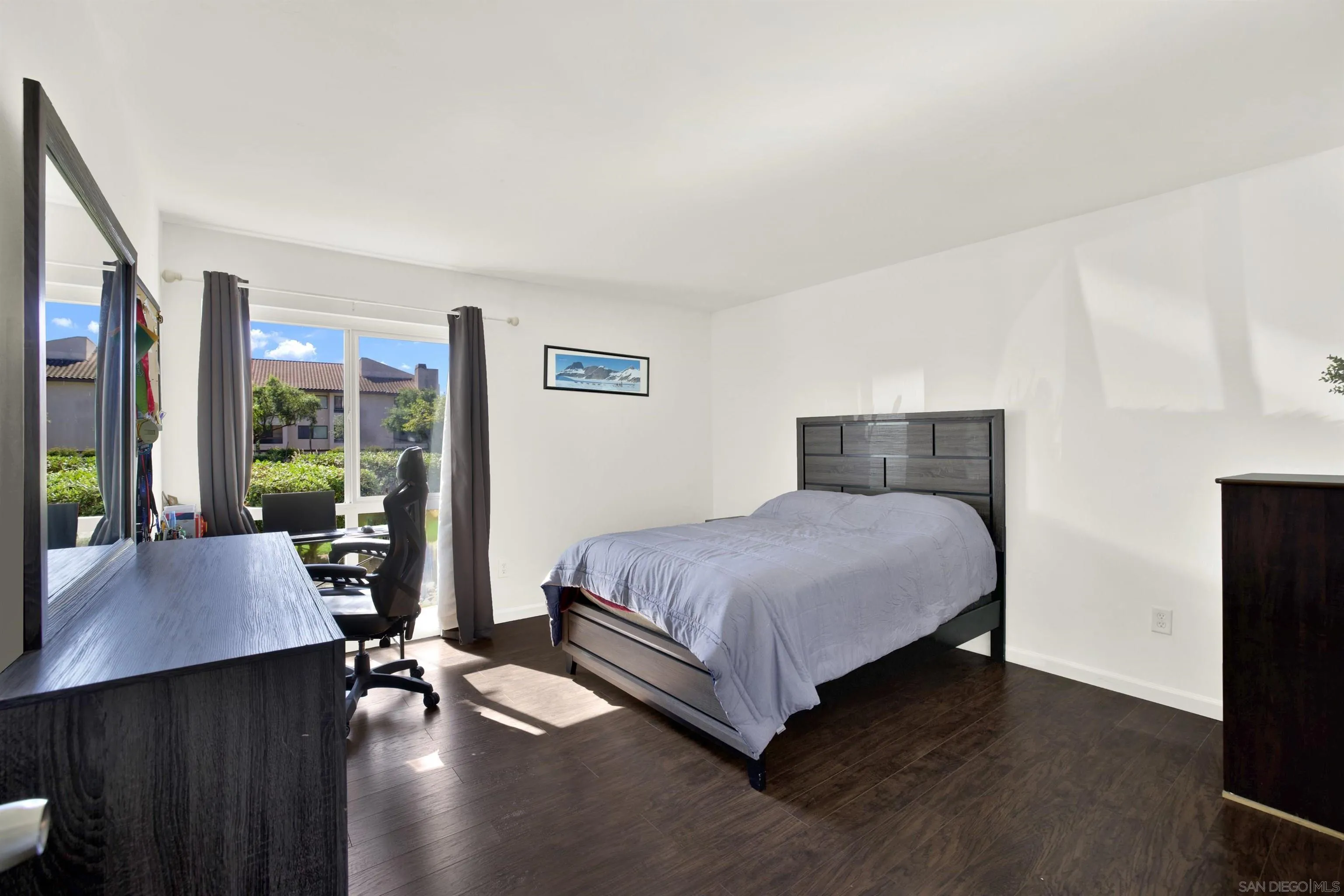 6780 Friars Road, Unit 153 San Diego, CA 92108 - Photo 5 of 21 a bedroom with a bed window and wooden floor