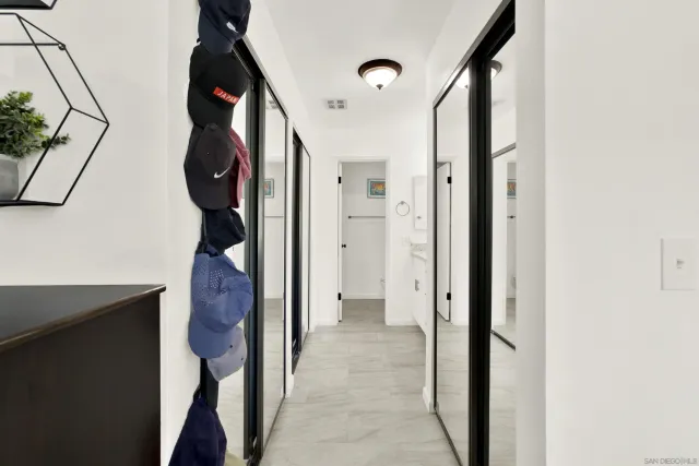 a view of hallway with wooden floor