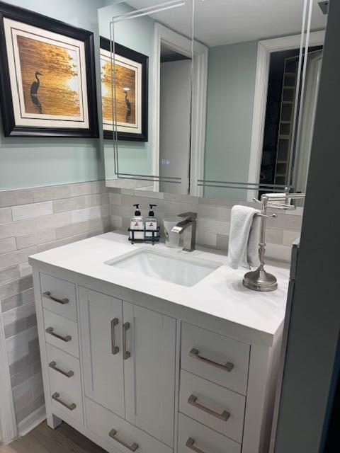 1030 Sugar Sands Boulevard, Unit 171 Singer Island, FL 33404 - Photo 13 of 20 a bathroom with a sink vanity and a mirror
