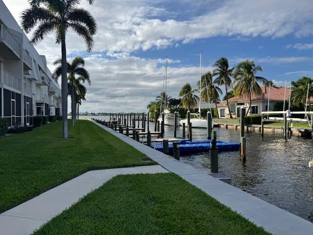 1030 Sugar Sands Boulevard, Unit 171 Singer Island, FL 33404 - Photo 19 of 20 a view of a swimming pool with a garden and patio
