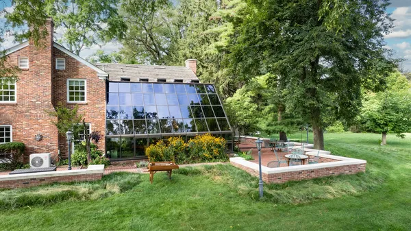 a view of a backyard with sitting area