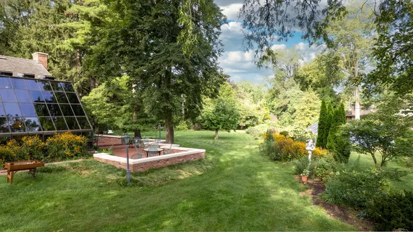 a view of grassy field with trees