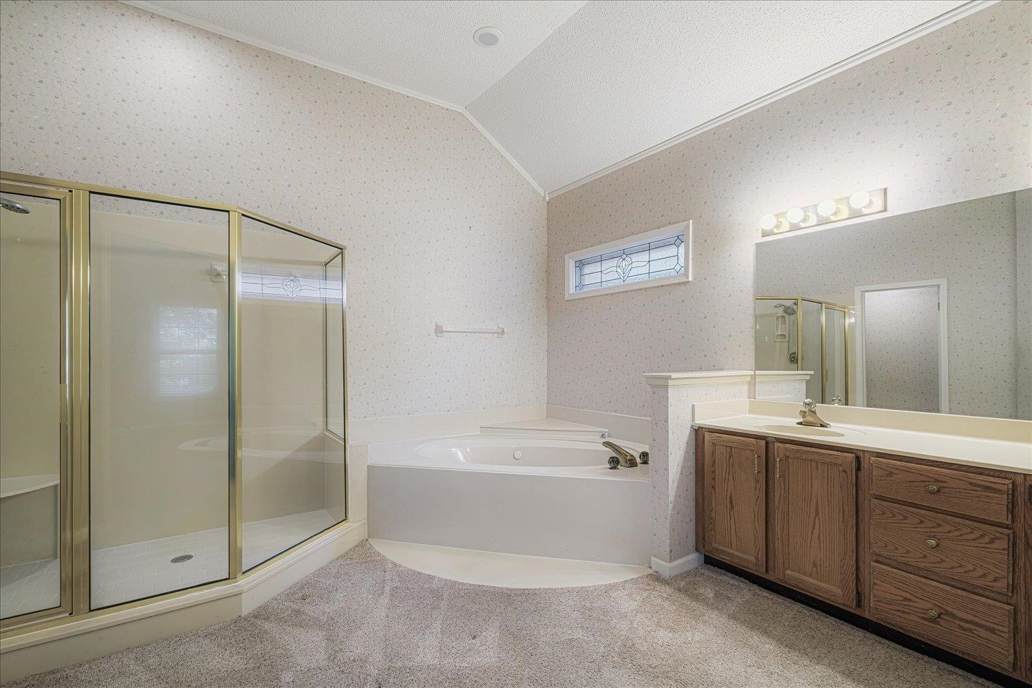 1665 Riverdale Road Germantown, TN 38138 - Photo 23 of 39 a bathroom with a bathtub shower sink mirror and toilet
