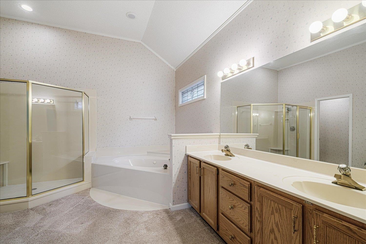 1665 Riverdale Road Germantown, TN 38138 - Photo 24 of 39 a bathroom with a tub sink double and mirror