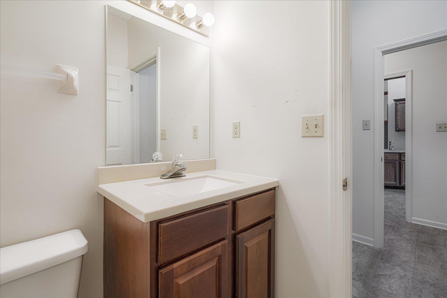 1665 Riverdale Road Germantown, TN 38138 - Photo 27 of 39 a bathroom with a sink and a toilet