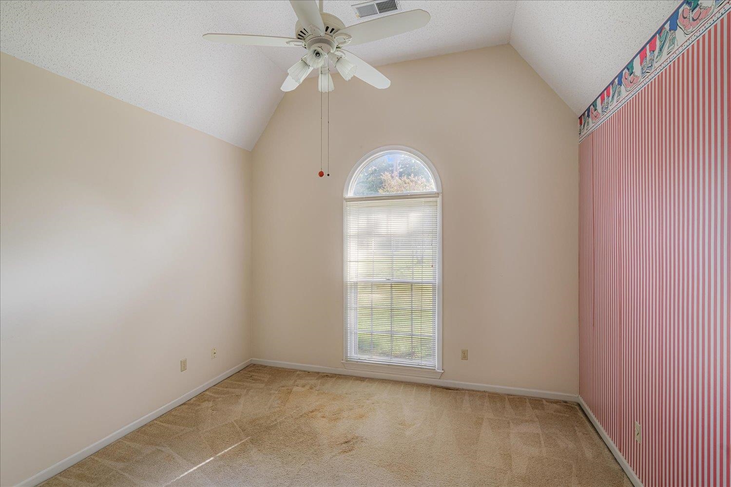 1665 Riverdale Road Germantown, TN 38138 - Photo 28 of 39 an empty room with a window and a fan