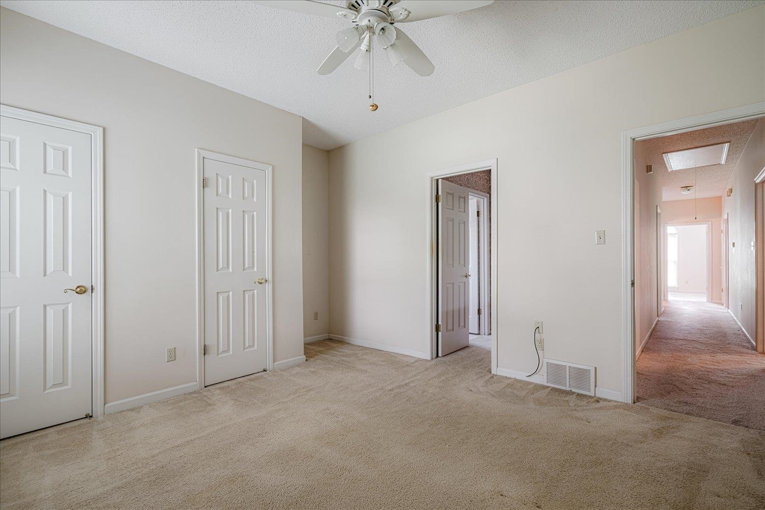 1665 Riverdale Road Germantown, TN 38138 - Photo 31 of 39 an empty room with a ceiling fan and a window