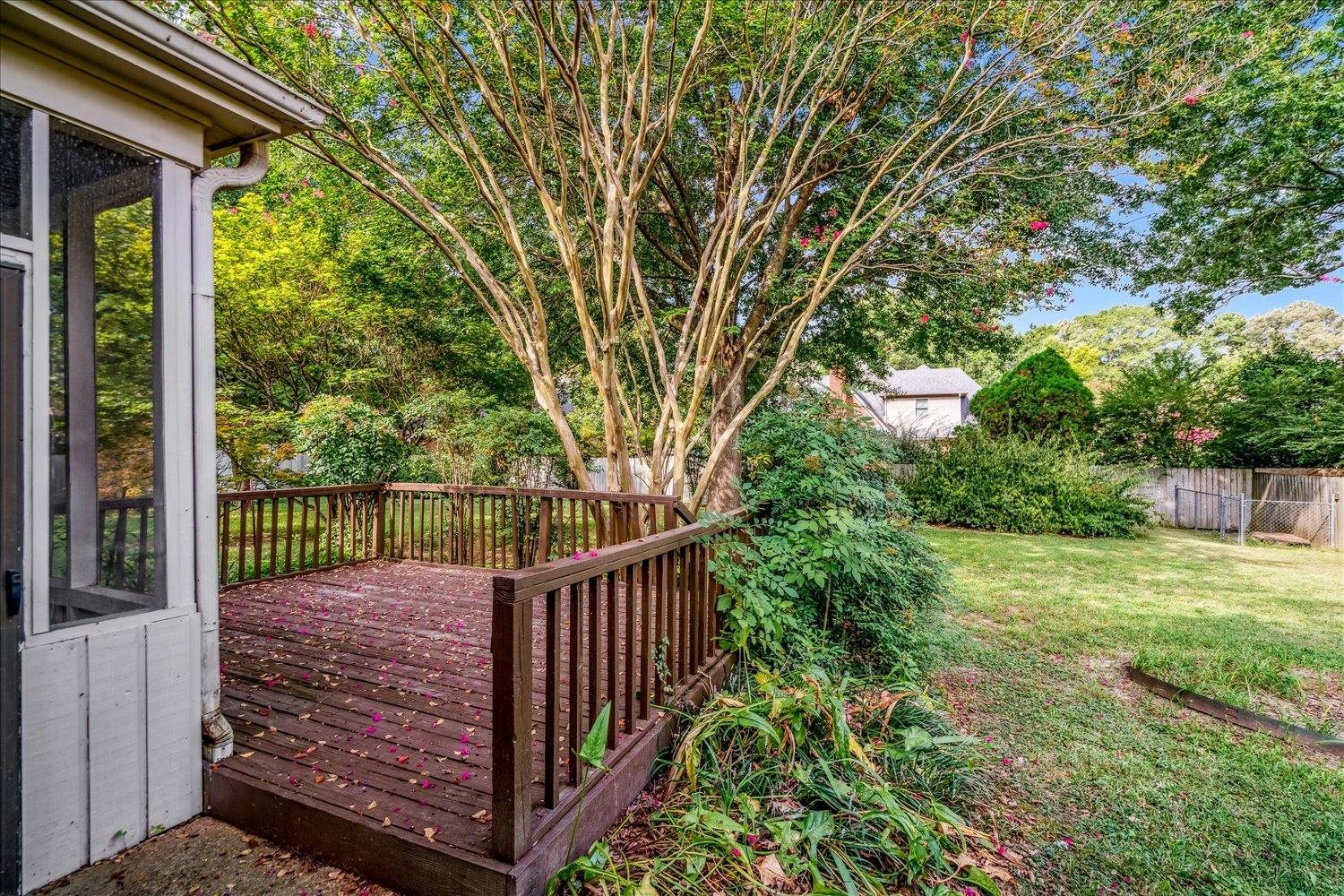 1665 Riverdale Road Germantown, TN 38138 - Photo 34 of 39 a view of a pathway of a yard with wooden fence and large trees