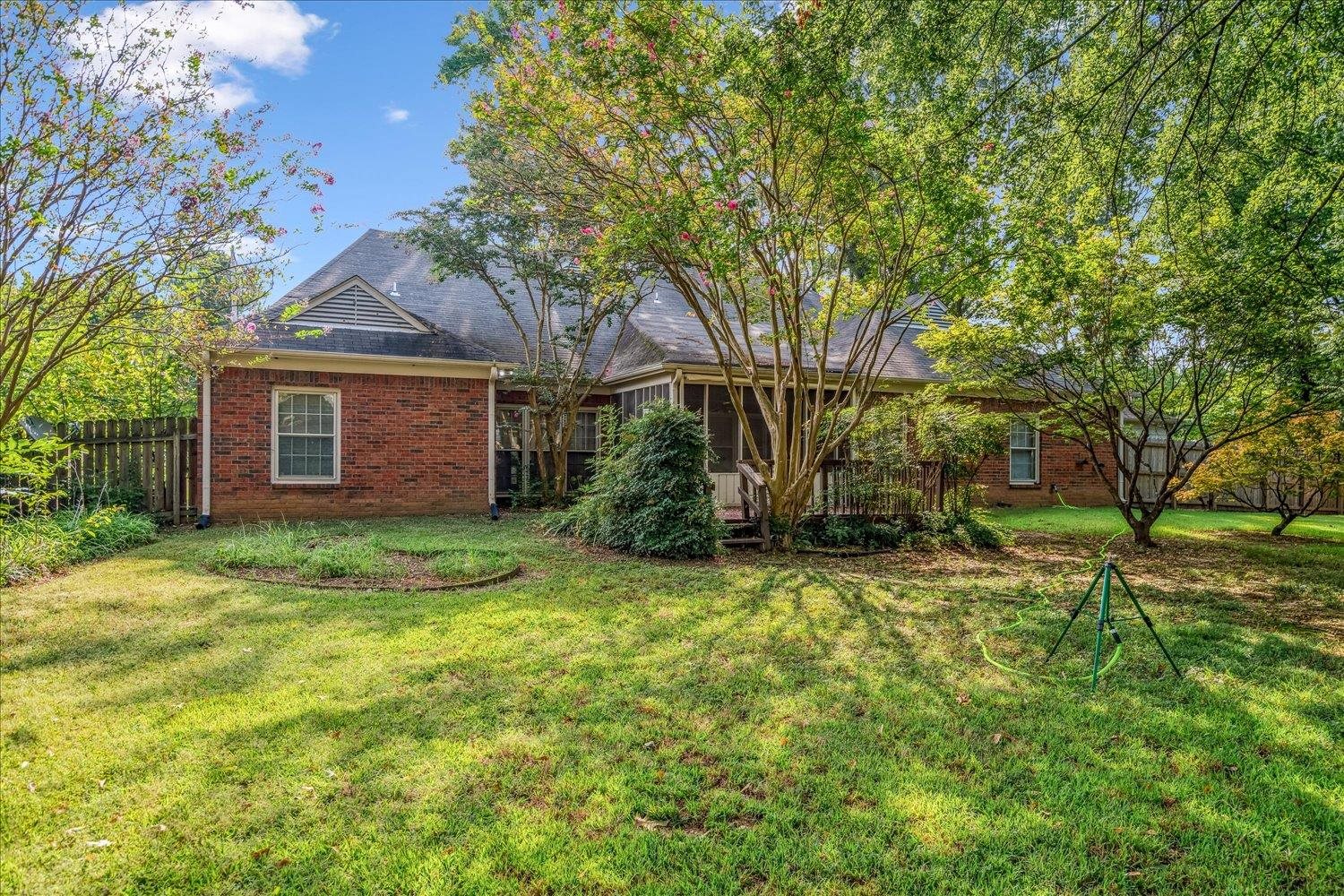 1665 Riverdale Road Germantown, TN 38138 - Photo 36 of 39 a view of a brick house with a large tree