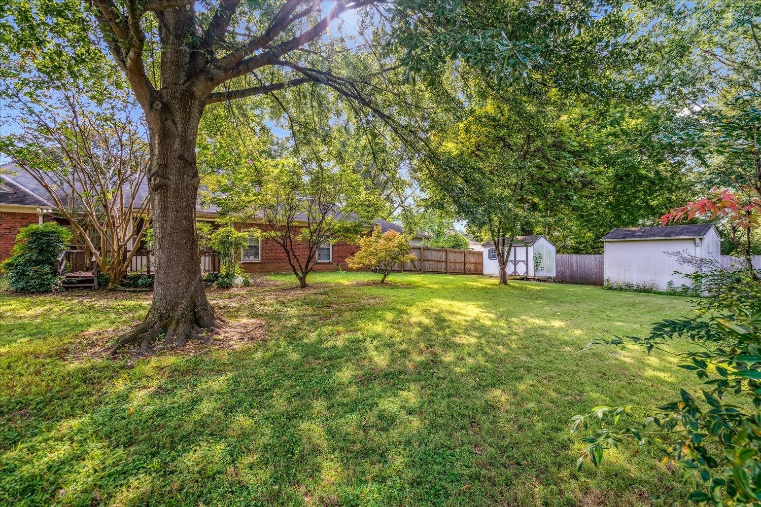 1665 Riverdale Road Germantown, TN 38138 - Photo 37 of 39 a backyard of a house with lots of green space