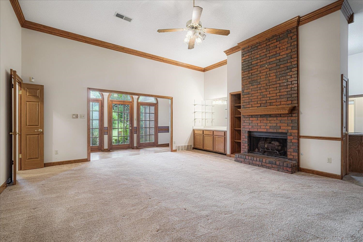 1665 Riverdale Road Germantown, TN 38138 - Photo 10 of 39 a view of a livingroom with a fireplace and window