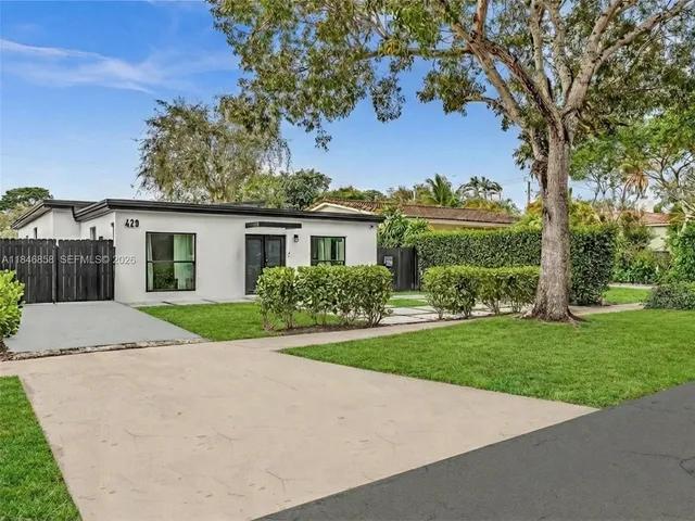 a view of house with outdoor space and garden