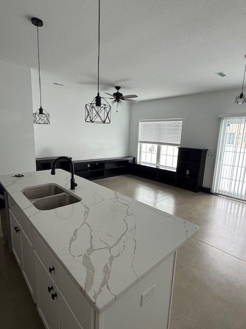 3304 Stoneway Court Champaign, IL 61822 - Photo 2 of 10 a kitchen with a sink and a stove top oven