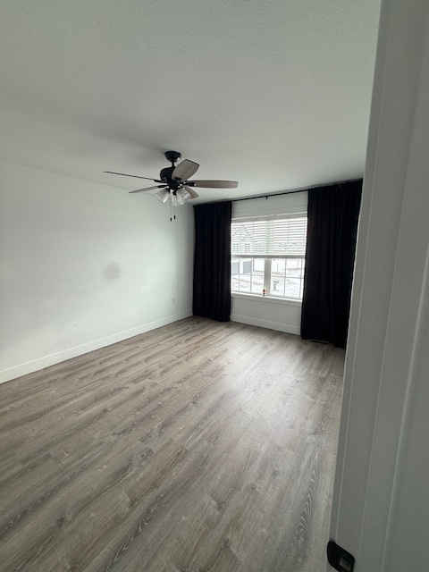 3304 Stoneway Court Champaign, IL 61822 - Photo 4 of 10 wooden floor in an empty room