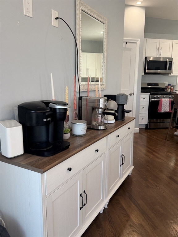 562 East 7th Street, Unit 2 Boston, MA 02127 - Photo 3 of 18 a kitchen with sink a microwave and cabinets