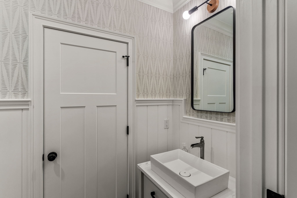 2 Chebacco Road Ipswich, MA 01938 - Photo 21 of 42 a bathroom with a sink a mirror and shower