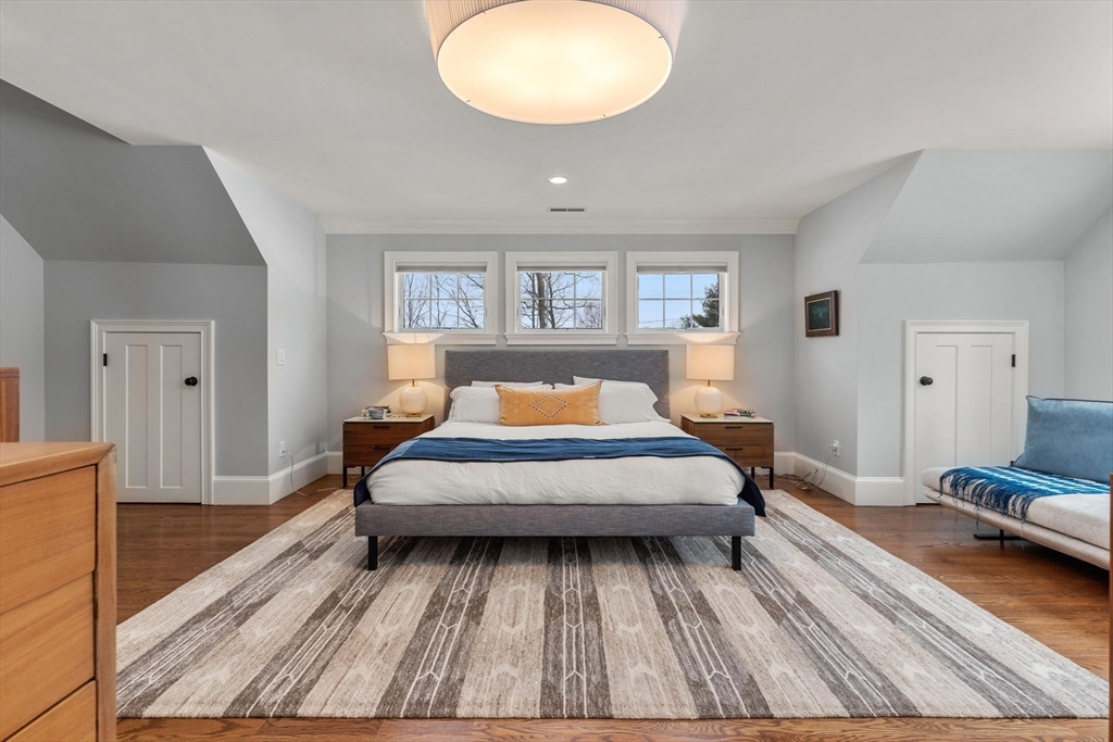 2 Chebacco Road Ipswich, MA 01938 - Photo 28 of 42 a spacious bedroom with a bed and a dresser