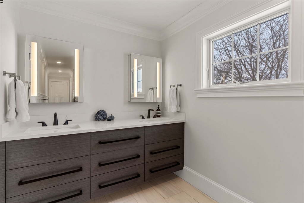 2 Chebacco Road Ipswich, MA 01938 - Photo 33 of 42 a bathroom with a double vanity sink and mirror