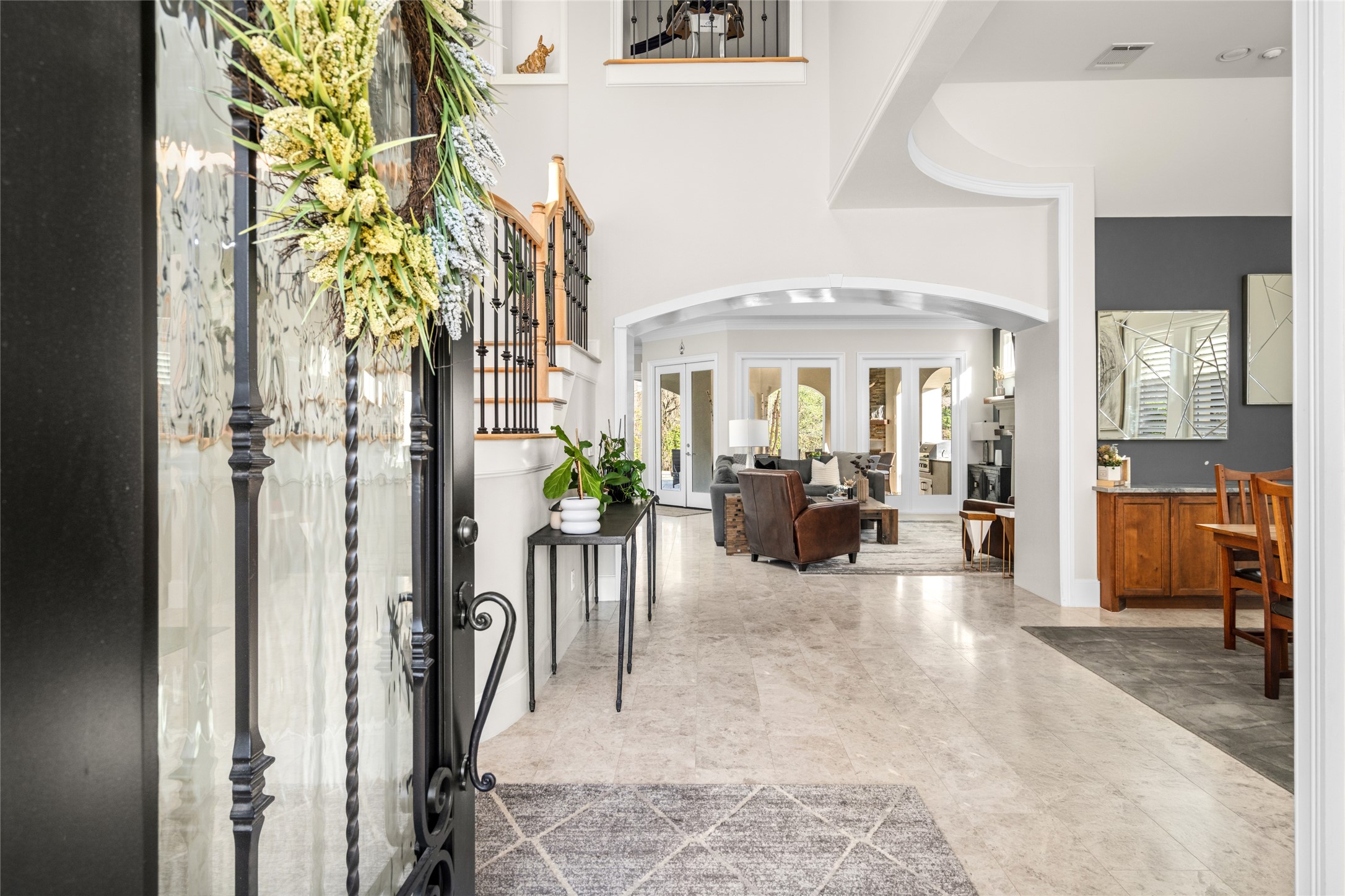 64 South Parkgate Circle Spring, TX 77381 - Photo 11 of 50 a view of a hallway with dining area and chandelier