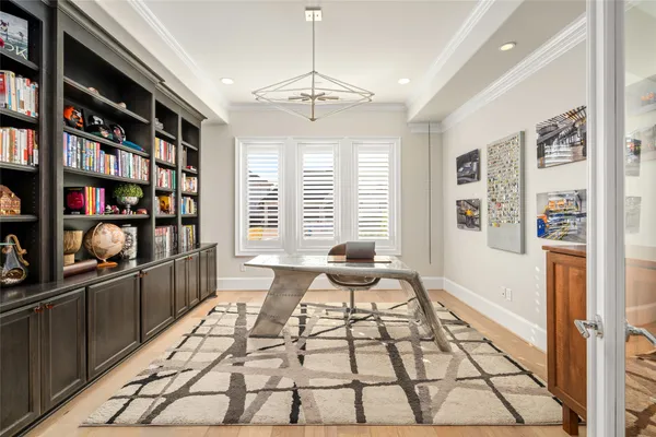 a living room with furniture cabinets and book shelf
