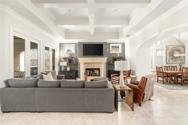 a living room with furniture fireplace and flat screen tv