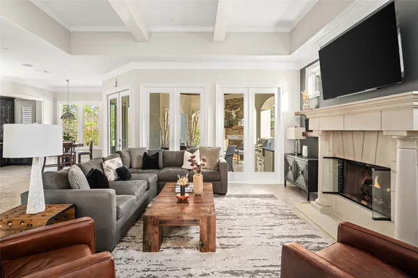 a living room with furniture fireplace and flat screen tv