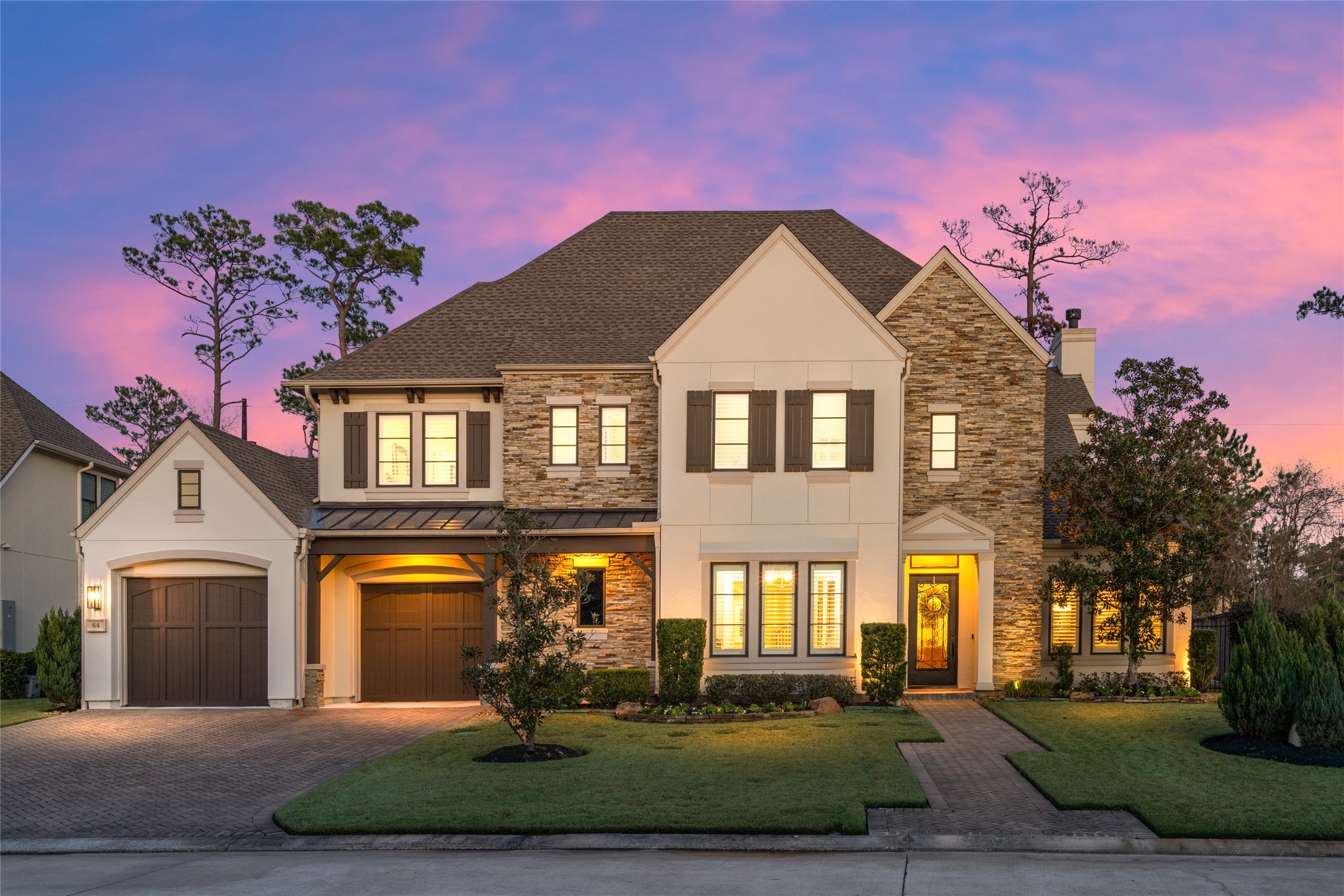 64 South Parkgate Circle Spring, TX 77381 - Photo 2 of 50 a front view of a house with a yard