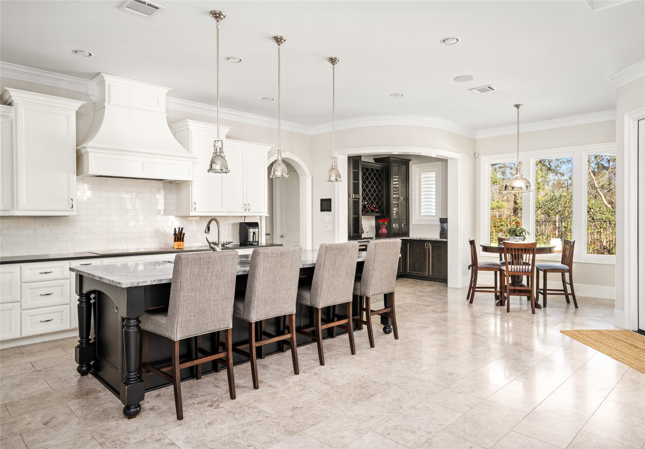 64 South Parkgate Circle Spring, TX 77381 - Photo 22 of 50 a view of dining table chairs kitchen island and stainless steel appliances