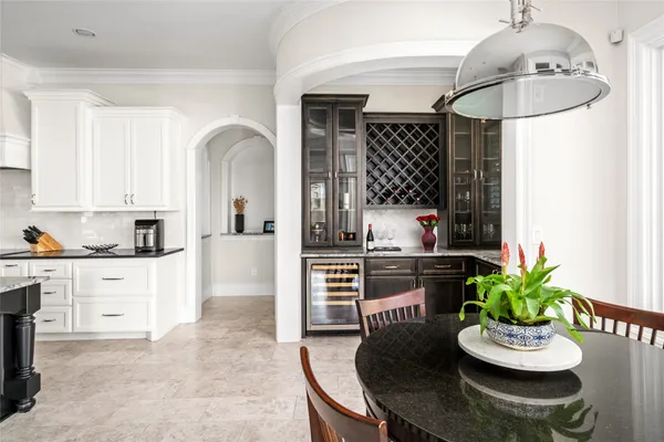 a kitchen with a table and chairs