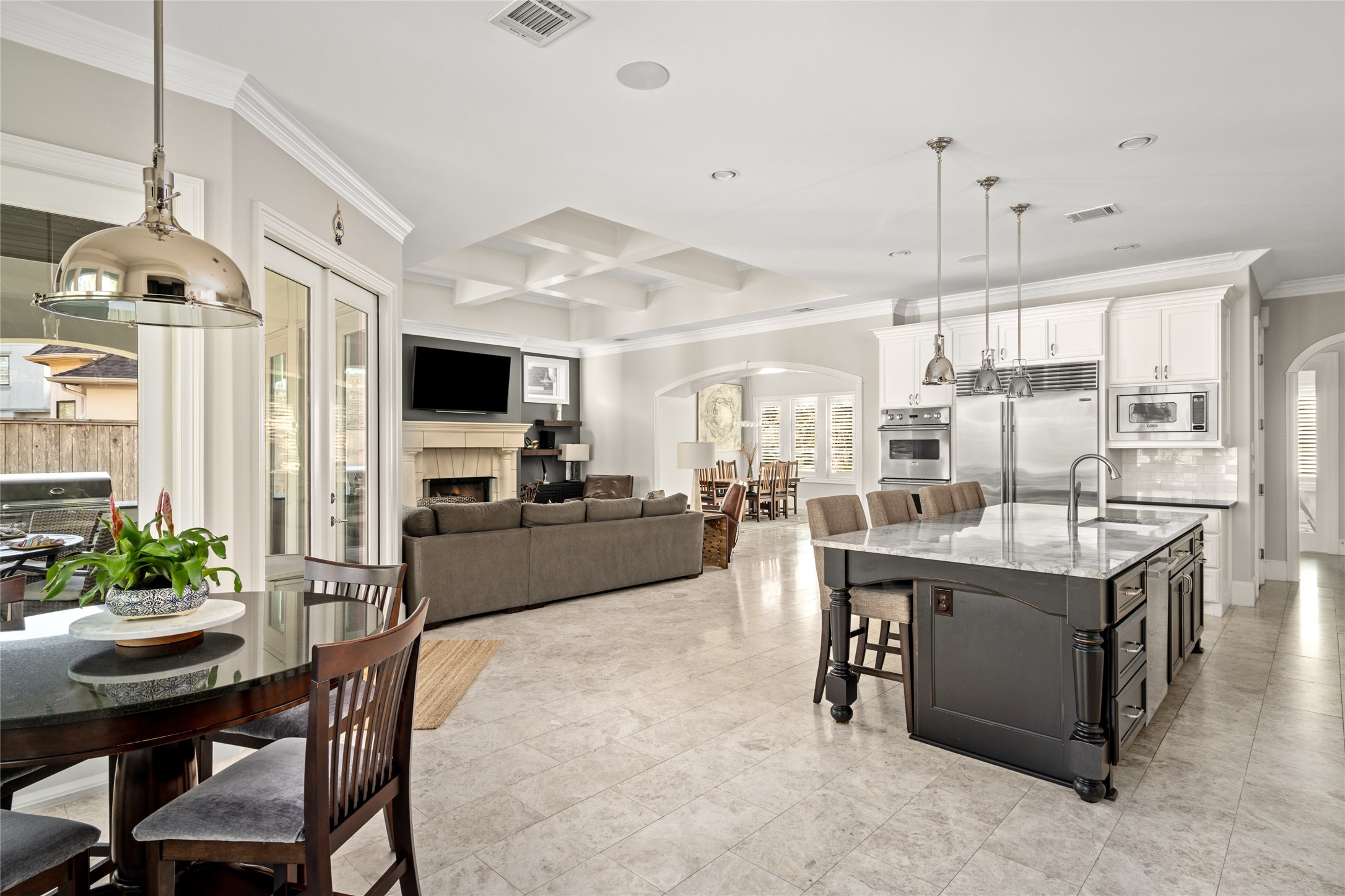 64 South Parkgate Circle Spring, TX 77381 - Photo 48 of 50 a kitchen with stainless steel appliances kitchen island granite countertop a table and chairs in it