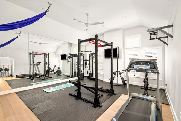 a bedroom with furniture and a rug