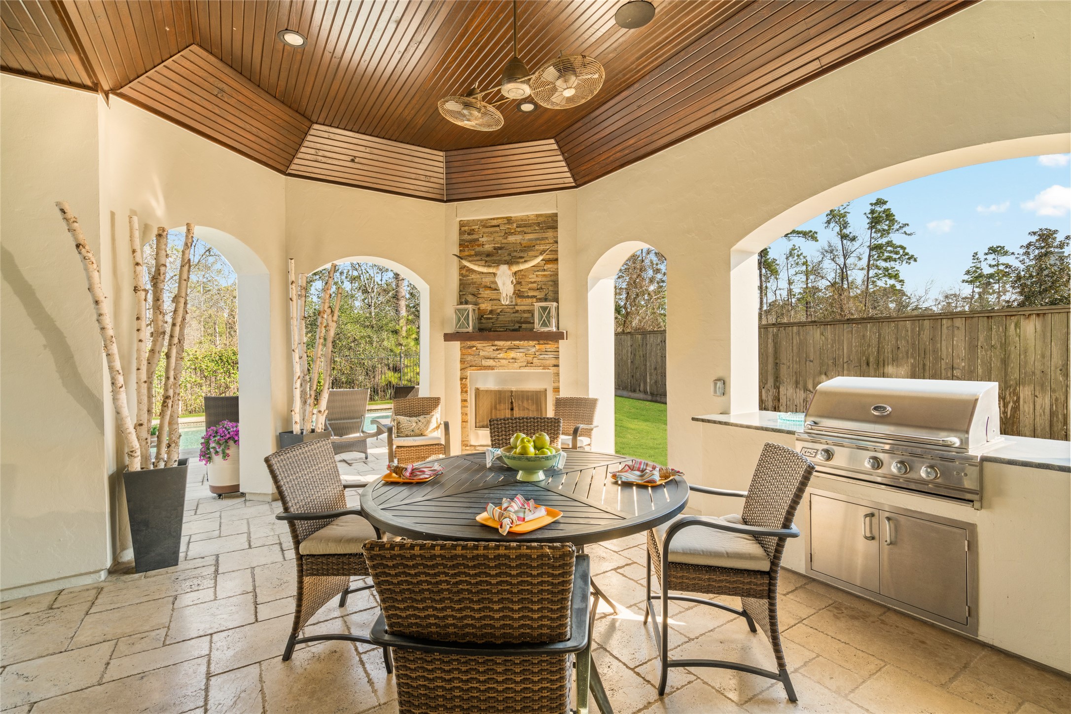 64 South Parkgate Circle Spring, TX 77381 - Photo 39 of 50 a dining room with furniture large windows and a chandelier