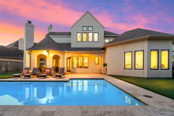 a front view of a house with swimming pool