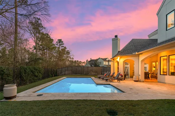 a view of a swimming pool with a lounge chairs